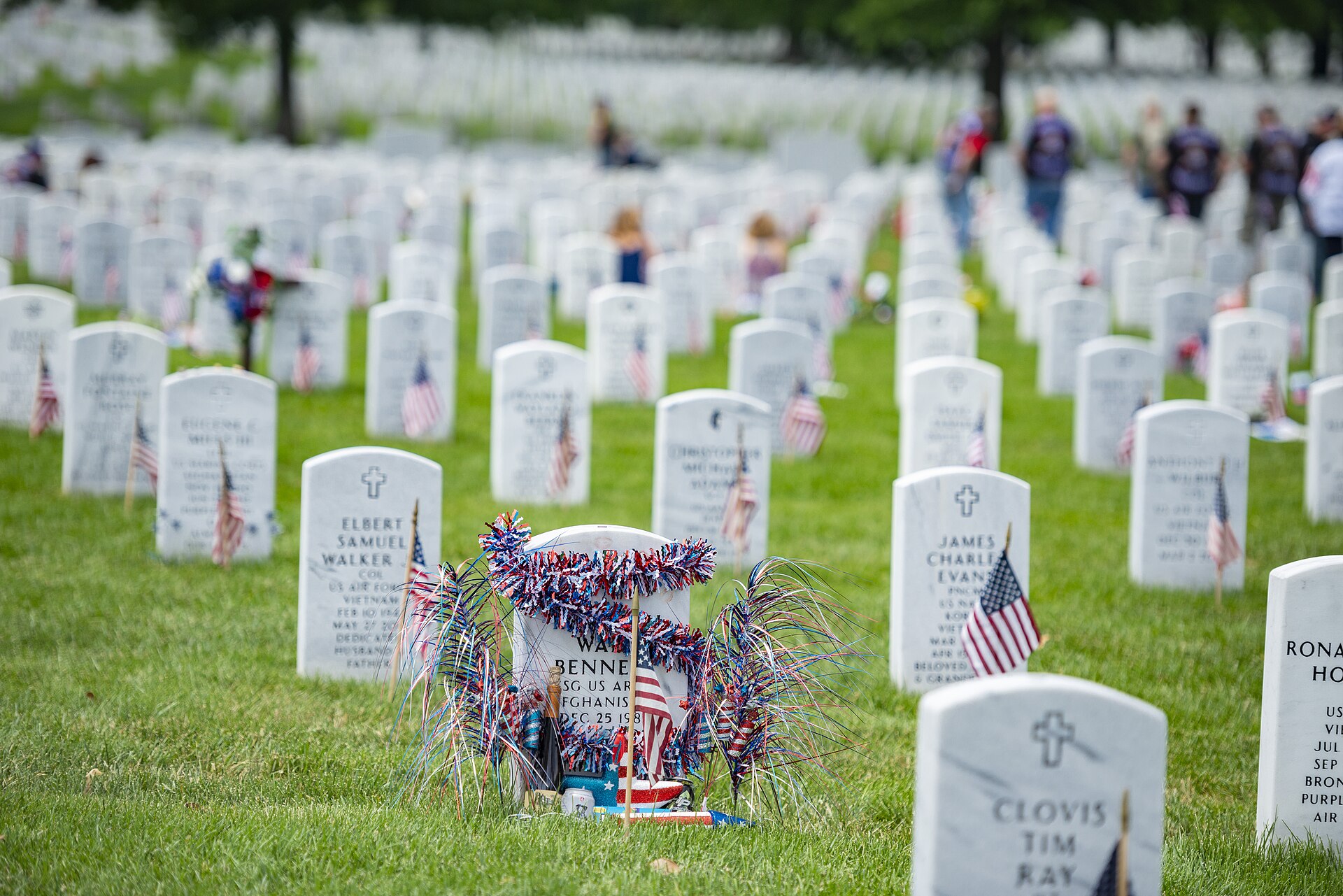 Flags and flowers on headstones at Arlington National Cemetery on Memorial Day weekend